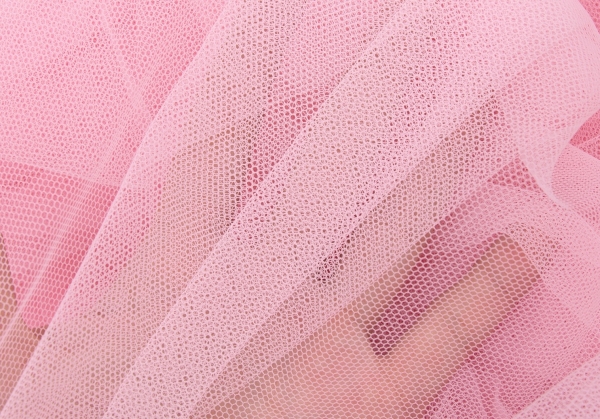 Photo of light pink tulle fabric in motion on Craiyon